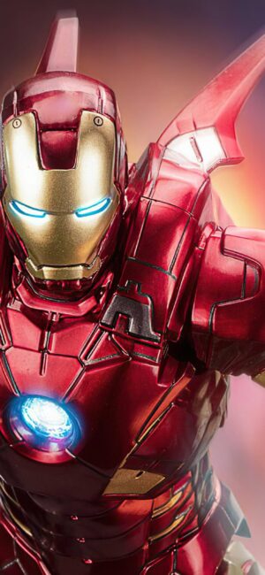 Iron Man in red and gold armor flying with glowing Arc Reactor | 4K Wallpaper for Desktop | Red, Gold, Blue Themes