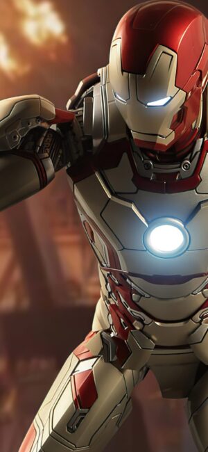 Iron Man in advanced suit with dynamic scene, warm tones, blurred elements | Red, White, Gold, Black | 4K Wallpaper for Desktop