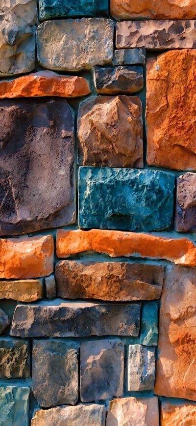 Artistic stone bricks in earthy hues of orange, brown, teal showcasing texture and shadow interplay | 4K Wallpaper for Mobile