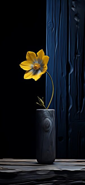 Single yellow flower in wooden vase on dark blue textured background, highlighting simplicity against moody tones | 4K Wallpaper for Mobile