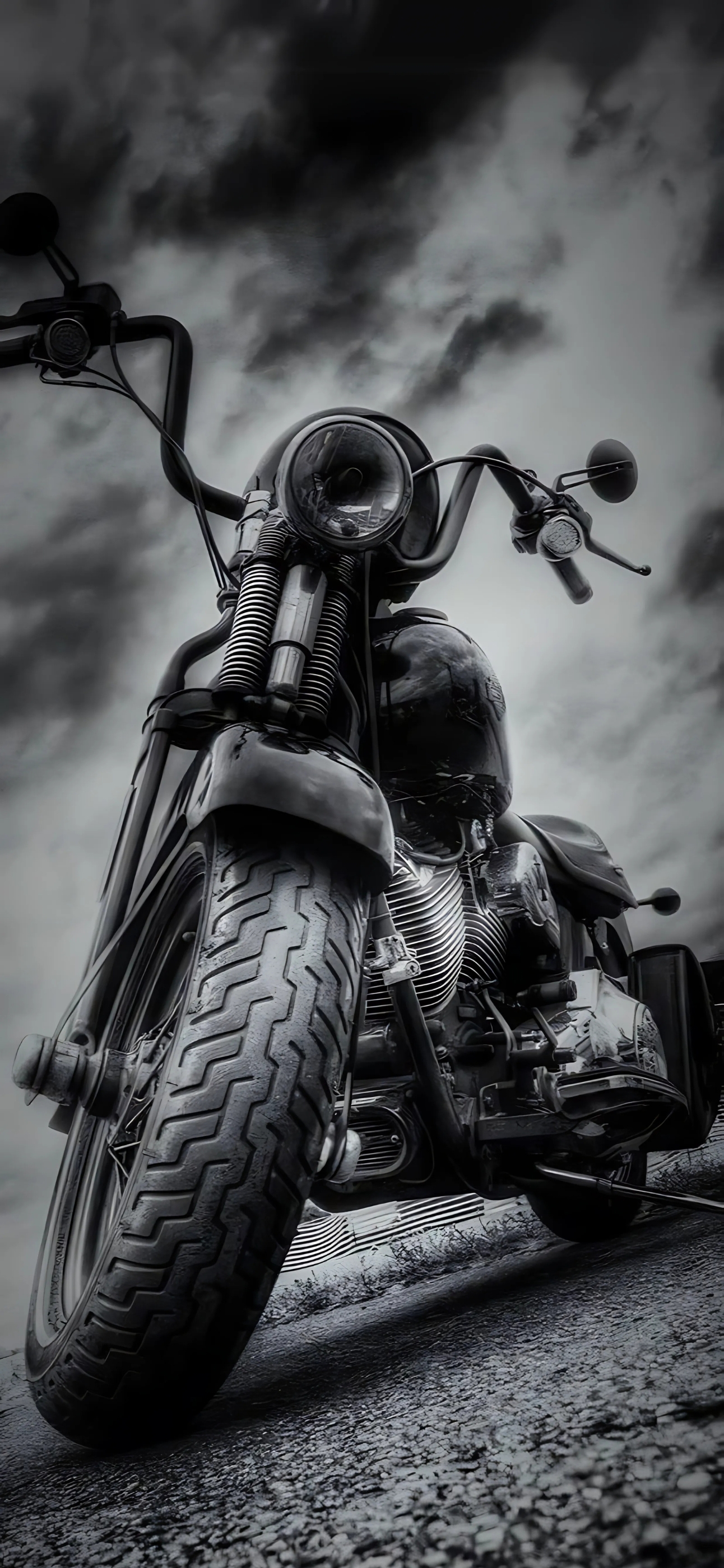 Black motorcycle with chrome details and rugged tire against a dramatic cloudy sky | Adventure and freedom | 4K Wallpaper for Mobile