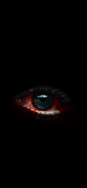 Eerie close-up of a bloodshot human eye in dark hues; intense blue and green with an unsettling gaze. | 4K Wallpaper for Mobile