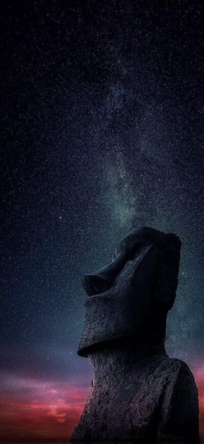 Moai statue under a starry Milky Way sky with sunset hues | Black, blue, purple, red tones | 4K Wallpaper for Mobile