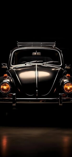 Vintage black Volkswagen Beetle with chrome accents and classic headlights on a dark backdrop | 4K Wallpaper for Mobile