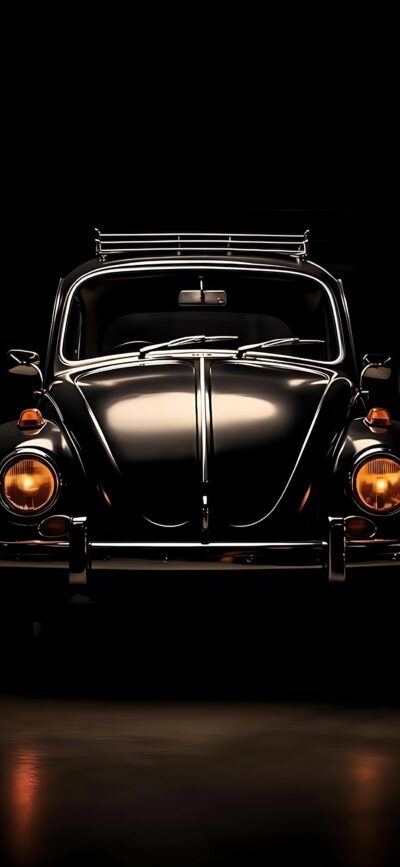 Vintage black Volkswagen Beetle with chrome accents and classic headlights on a dark backdrop | 4K Wallpaper for Mobile