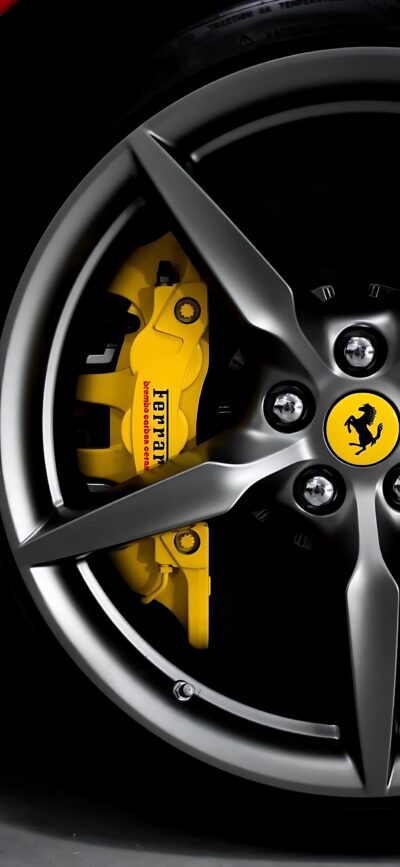 Ferrari wheel close-up with yellow brake caliper & iconic logo, sleek design | 4K Wallpaper for Mobile | Black, Yellow, Silver