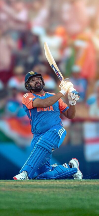 Cricket player in blue and orange uniform swinging bat, vibrant stadium backdrop | 4K Wallpaper for Mobile