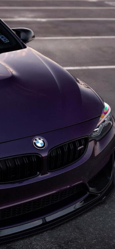 Purple BMW car front view with logo | 4K Wallpaper for Mobile | Perfect for car enthusiasts & lovers of purple, black, gray themes.