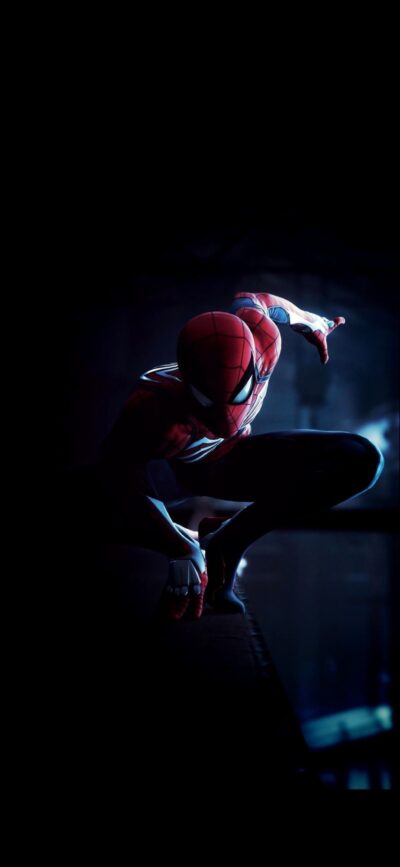 Spiderman in action against a dark backdrop, showcasing his red and blue suit's agility and strength | 4K Wallpaper for Mobile