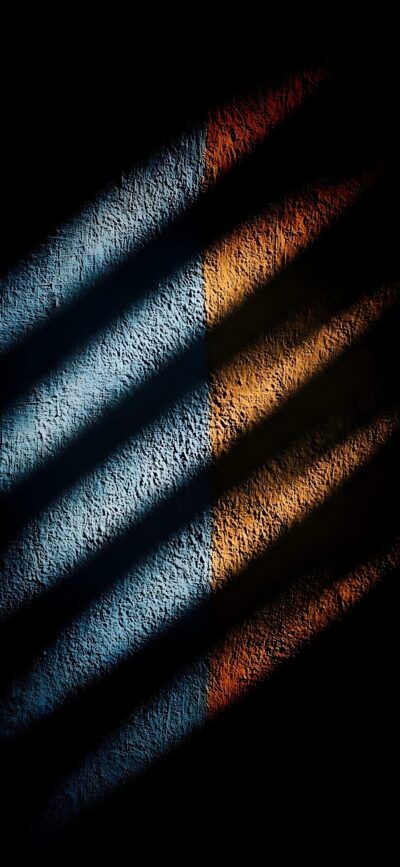 Abstract 4K mobile wallpaper: Blue and orange textured wall with shadowy lines, creating dramatic contrast | 4K Wallpaper for Mobile