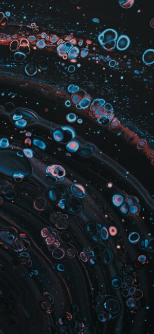 Abstract swirling blue and red bubbles on dark background, cosmic or underwater effect | 4K Wallpaper for Mobile