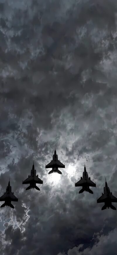 Fighter jets soar in stormy skies with sun glow | 4K Wallpaper for Mobile | Gray, Black, White tones | Military, Aircraft themes