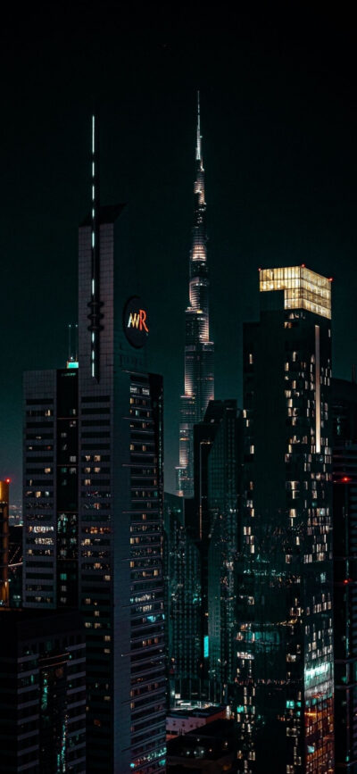 Striking cityscape at night with illuminated skyscrapers, featuring Burj Khalifa | 4K Wallpaper for Mobile