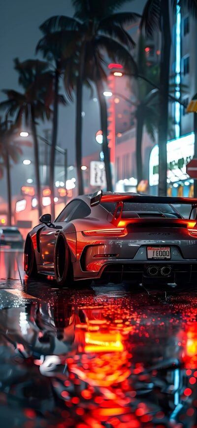 Sleek sports car on a wet city street with neon lights and palm trees at night | 4K Wallpaper, for Mobile