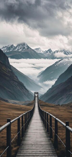 Suspension bridge in misty mountains, serene atmosphere. Primary colors: gray, blue, brown. | 4K Wallpaper for Mobile