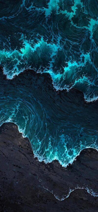 Aerial view of ocean waves crashing onto rocks with deep blue and turquoise waters | 4K Wallpaper for Mobile