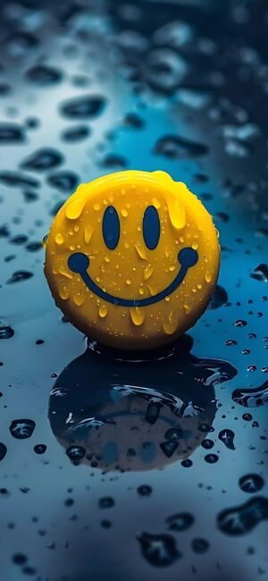 Vibrant yellow smiley face on a wet surface with water droplets, creating a cheerful scene. | 4K Wallpaper for Mobile