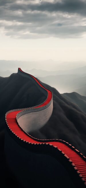 Winding Great Wall with red pathway on rugged mountains under a cloudy sky | 4K Wallpaper, for Mobile