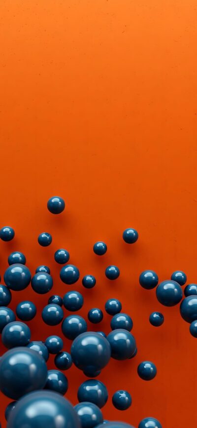 Abstract vibrant design with glossy blue spheres on an orange background, dynamic and modern aesthetic | 4K Wallpaper for Mobile