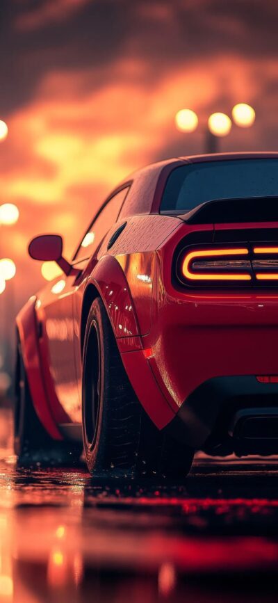 Red sports car against glowing orange sky with illuminated tail lights; perfect for auto enthusiasts | 4K Wallpaper for Mobile