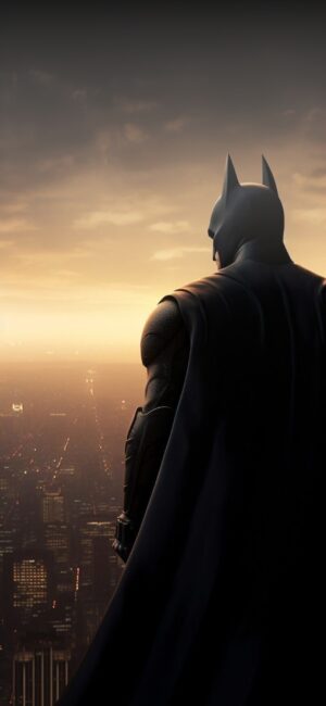 Batman overlooking cityscape at dusk, iconic silhouette against glowing horizon | 4K Wallpaper for Mobile | Black, Orange, Brown