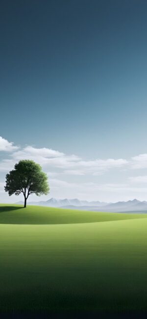 A serene landscape wallpaper with a lone tree on a green hill under a blue sky and mountains. Perfect for mobile | 4K Wallpaper.