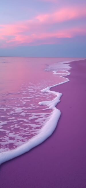 Serene beach scene with pink and purple sky; tranquil waves and soft pink sand | 4K Wallpaper for Mobile