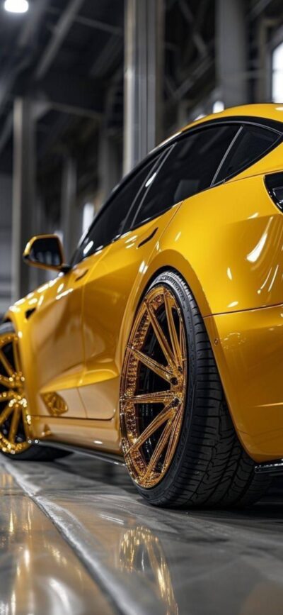 Yellow sports car in a modern garage with stylish rims and glossy finish | 4K Wallpaper for Mobile