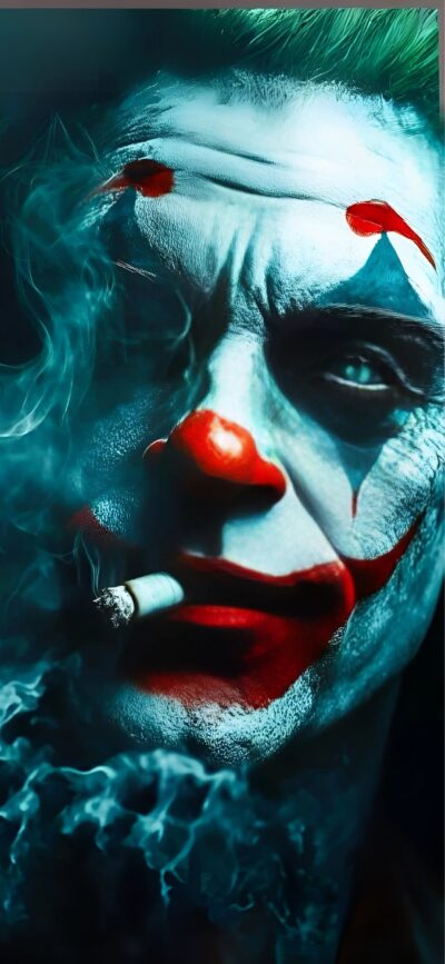 Menacing clown with white face paint, red nose, and red lips resembles Joker, holding a smoking cigarette | 4K Wallpaper for Mobile