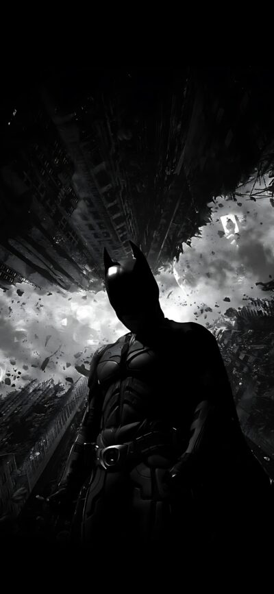 Batman in dramatic cityscape with swirling clouds and debris; silhouette highlighted in gritty urban setting for Mobile | 4K Wallpaper