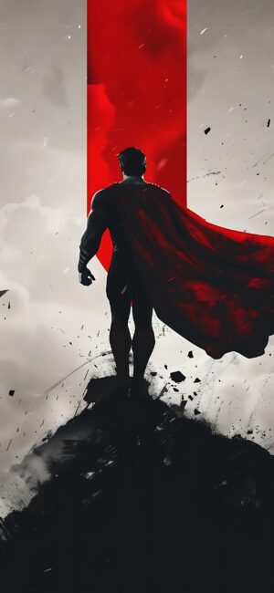 Superhero silhouette with red cape on rugged landscape, dramatic red-gray backdrop | 4K Wallpaper for Mobile