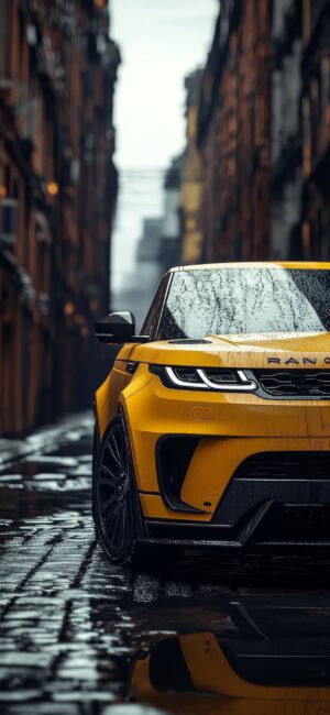 Yellow Range Rover in wet urban alley reflecting light | 4K Wallpaper for Mobile