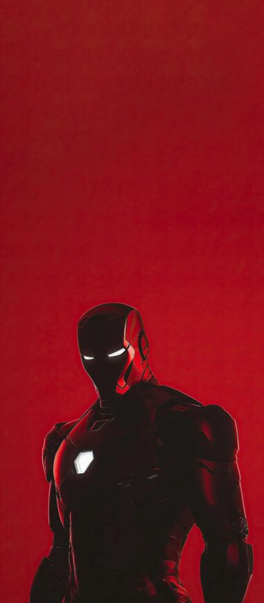 Iron Man in a striking pose, glowing chest piece, bold red background | 4K Wallpaper for Mobile